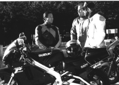 Doc Wong instructing two other riders